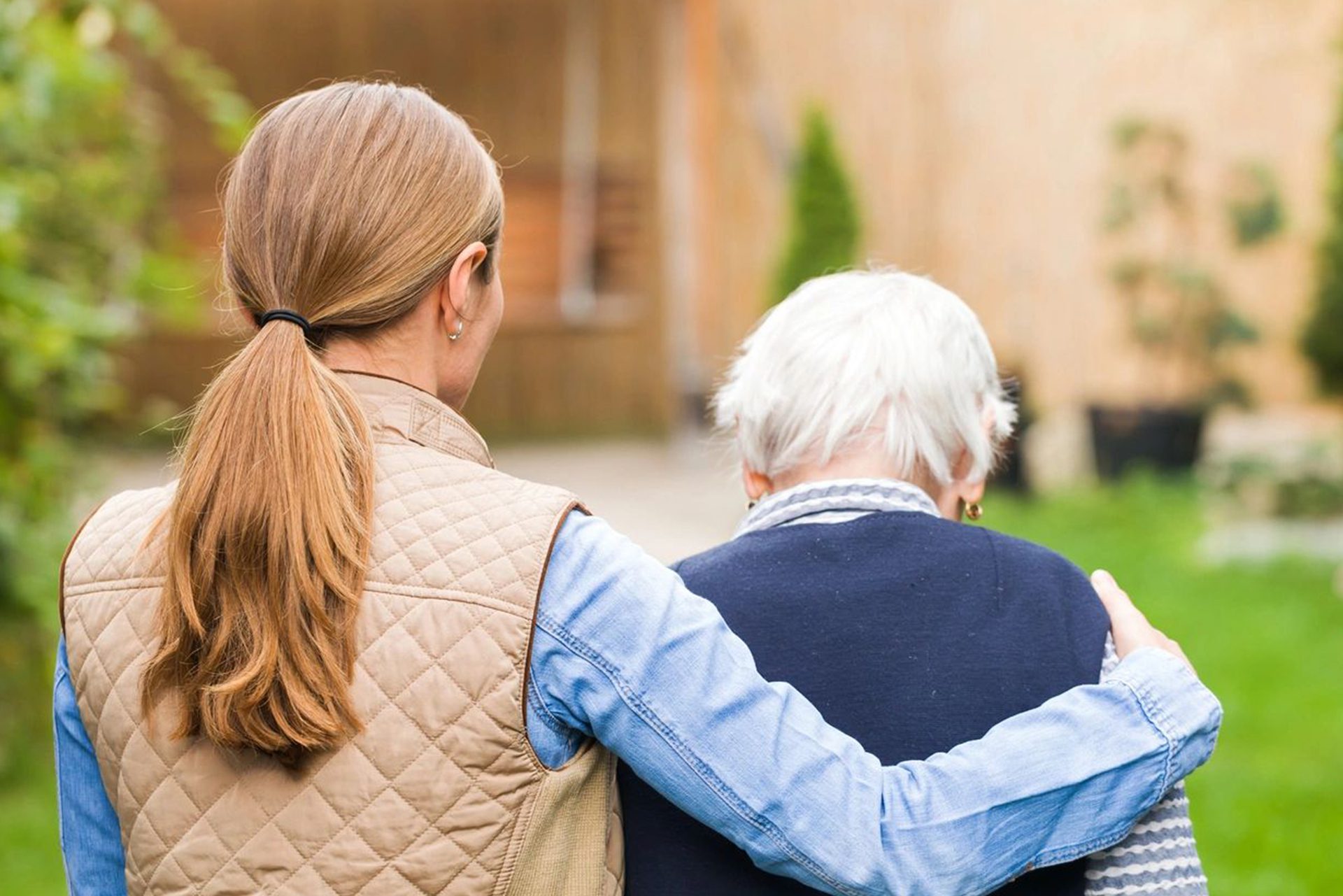 5 A woman and an older man are standing outside.