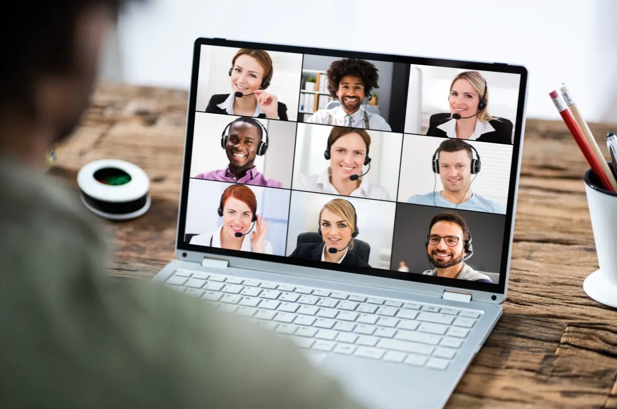 Video conference call with multiple participants displayed.